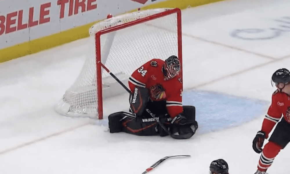 Petr Mrazek #34 makes a save using Taylor Halls stick during the Chicago Blackhawks matchup with the Minnesota Wild.